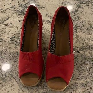Women’s 8 toms red wedge. Barely worn.